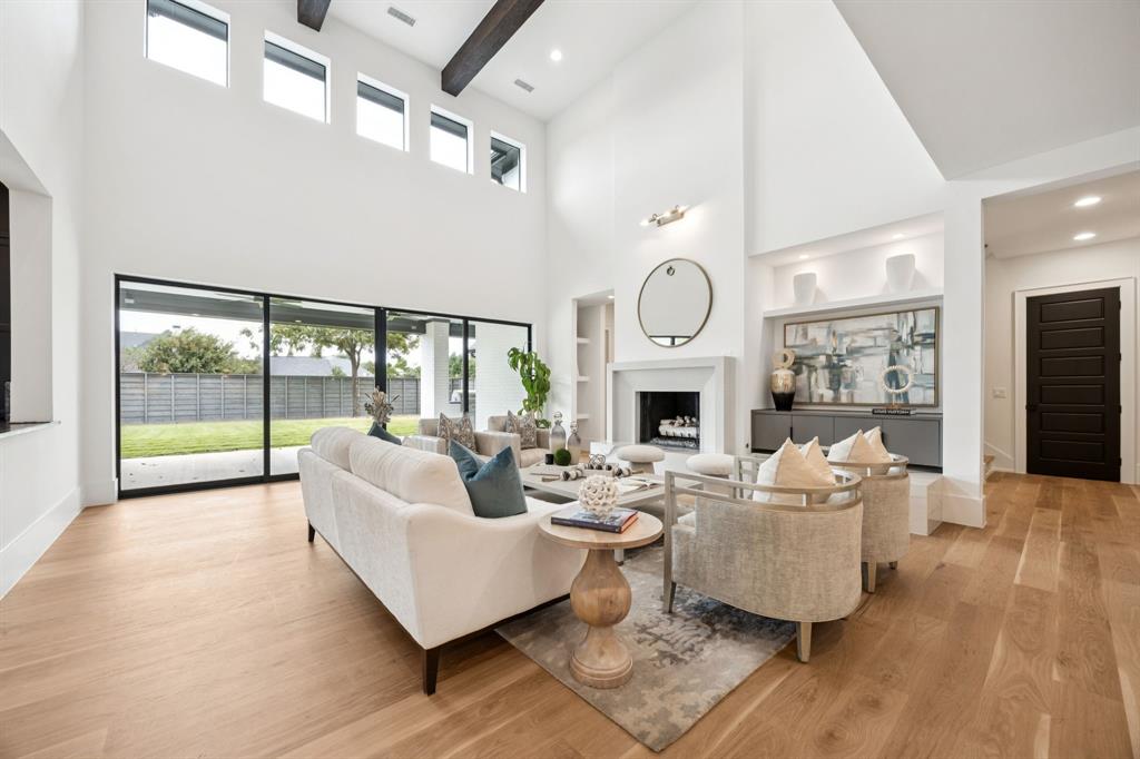 4330 Ridge Road Dallas, TX 75229 - Photo 10 of 30 a living room with fireplace furniture and a large window