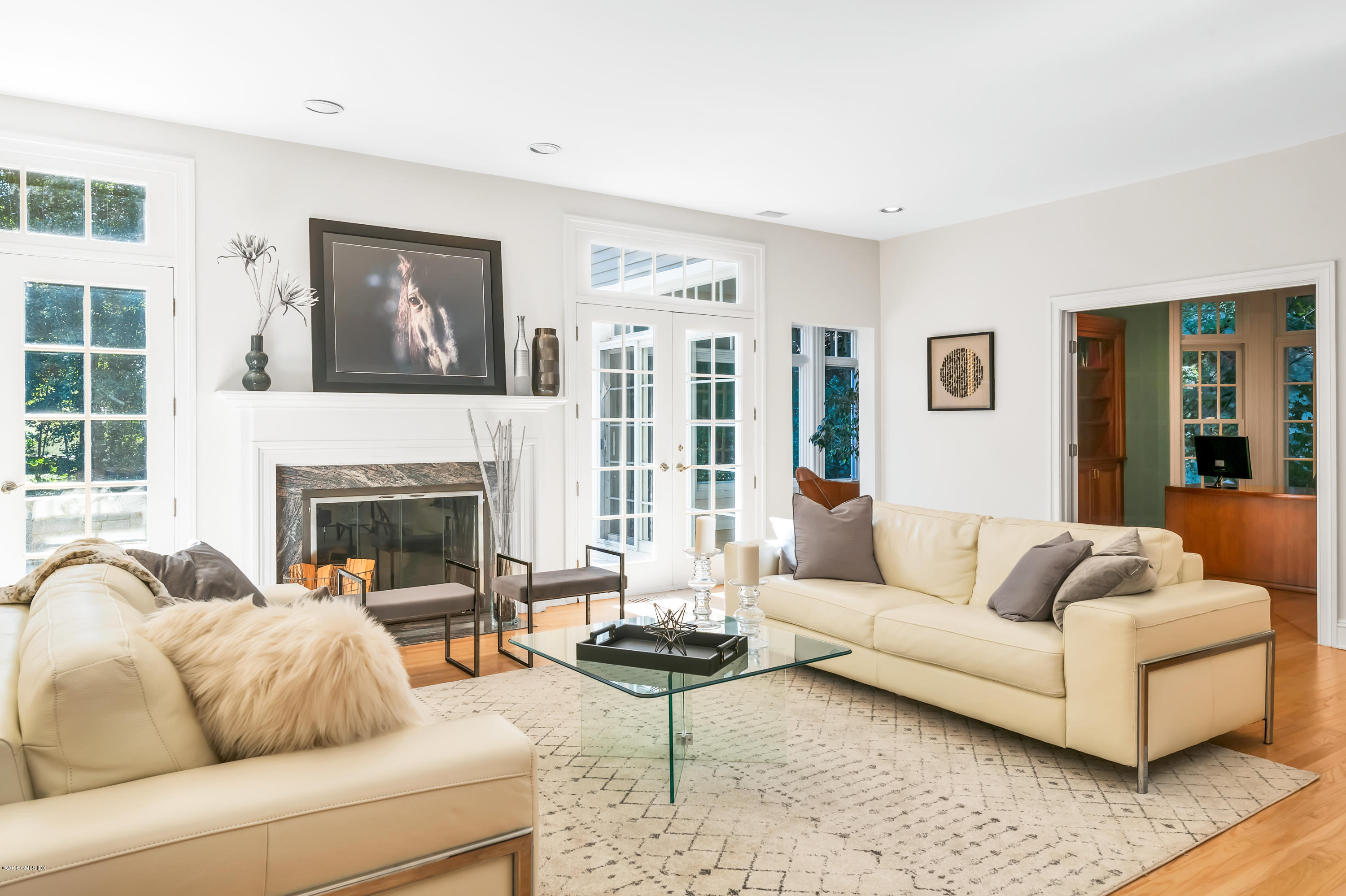 329 Stanwich Road Greenwich, CT 06830 - Photo 14 of 39 a living room with furniture and a fireplace