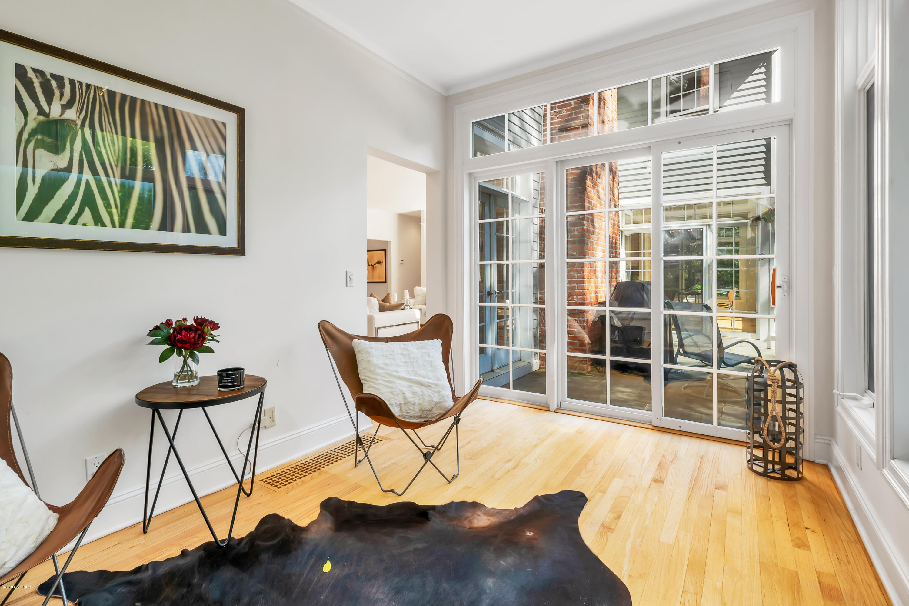 329 Stanwich Road Greenwich, CT 06830 - Photo 15 of 39 a view of a workspace with furniture and floor to ceiling window