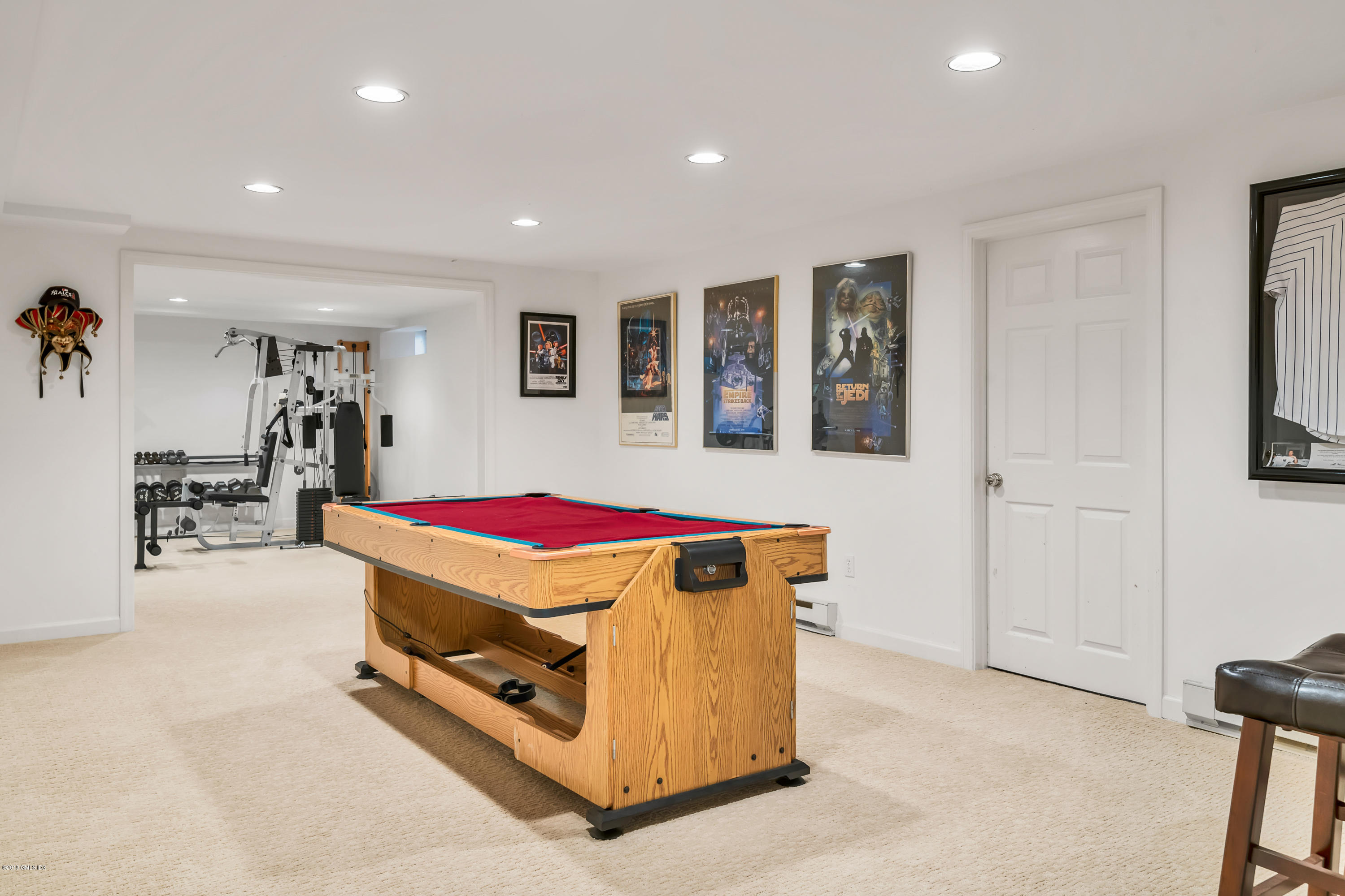 329 Stanwich Road Greenwich, CT 06830 - Photo 32 of 39 a living room with a rug and gym equipment
