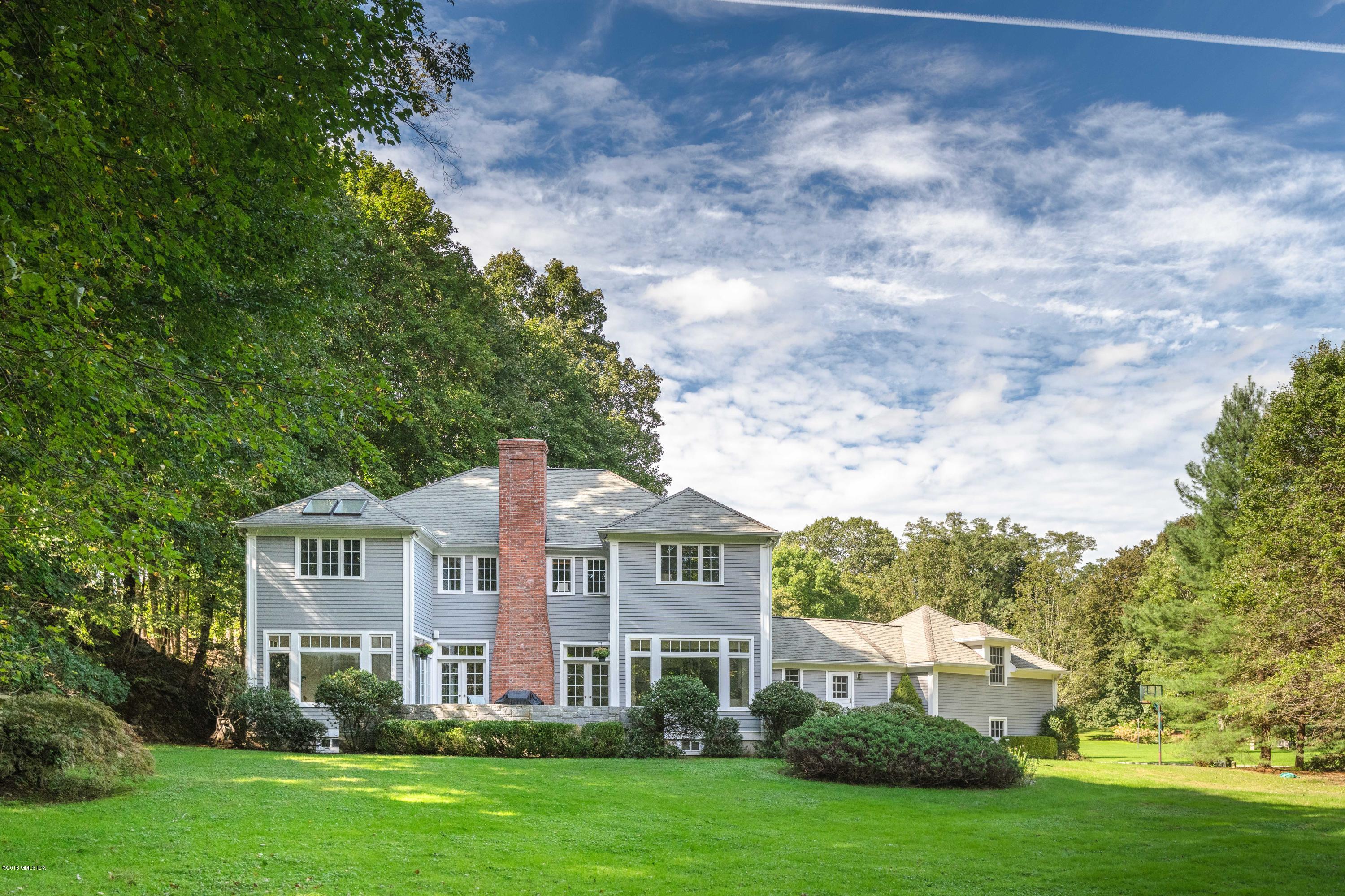 329 Stanwich Road Greenwich, CT 06830 - Photo 34 of 39 a front view of a house with a yard