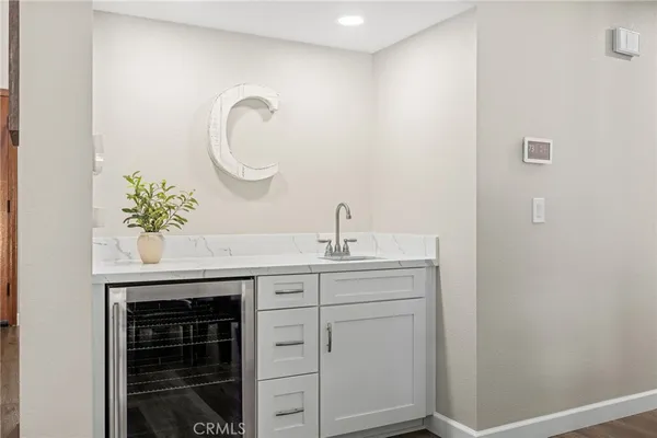 a spacious bathroom with a tub sink and mirror