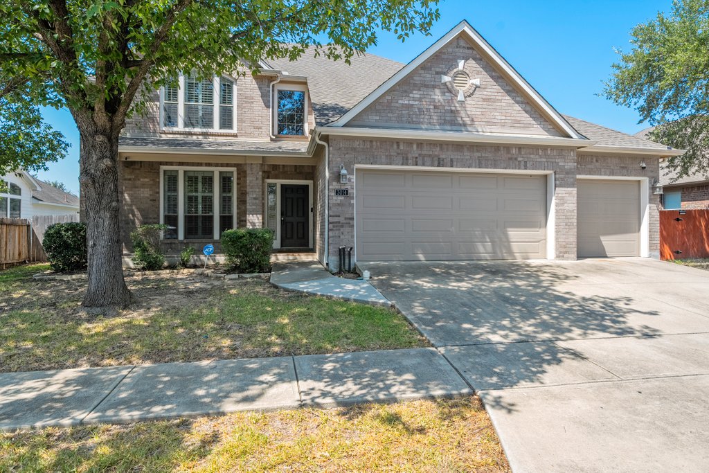 3014 Hidden Meadow Seguin, TX 78155 - Photo 1 of 1 View of front of home featuring a garage, a porch, brick siding, concrete driveway, and a shingled roof