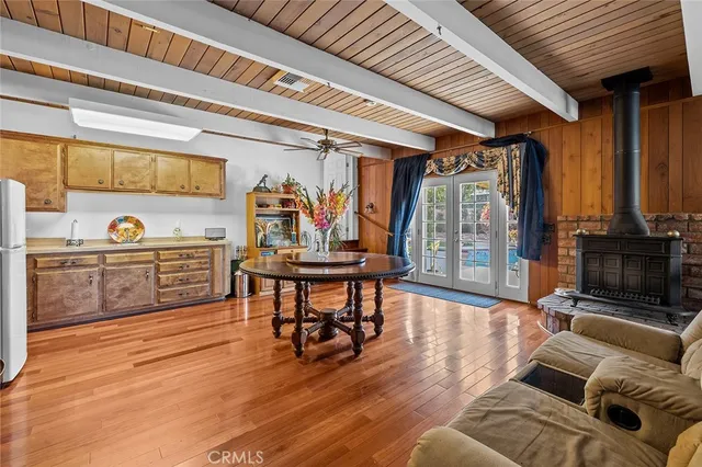 a living room with furniture large window and a fireplace