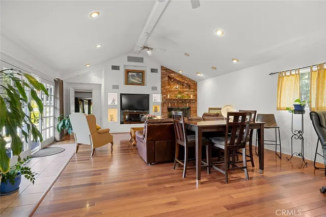 an aerial view of a house with a yard and outdoor seating