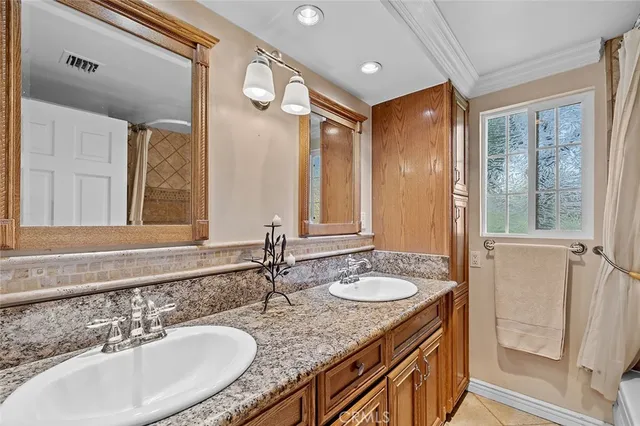 a spacious bedroom with a bed and a large window