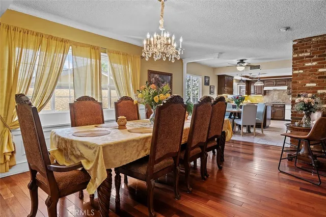 a bathroom with a granite countertop toilet a sink and mirror