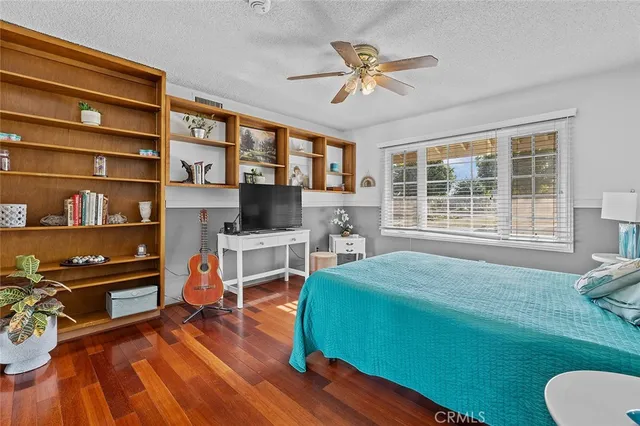 a kitchen with stainless steel appliances a sink a stove and a wooden cabinets