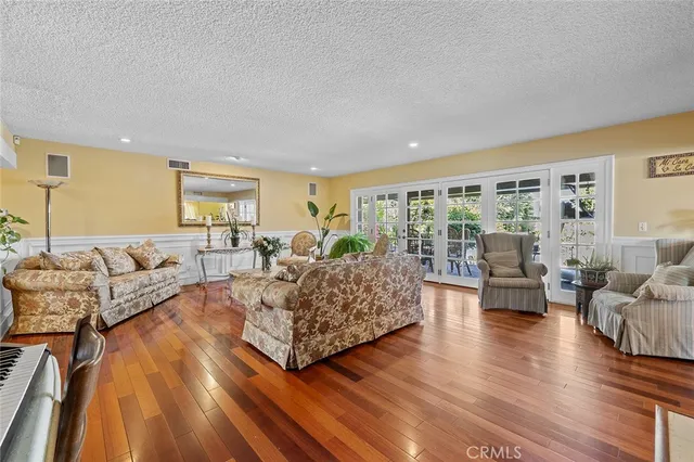 an aerial view of a house with a yard and trees
