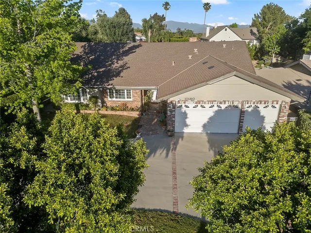 a front view of house with yard outdoor seating and barbeque oven