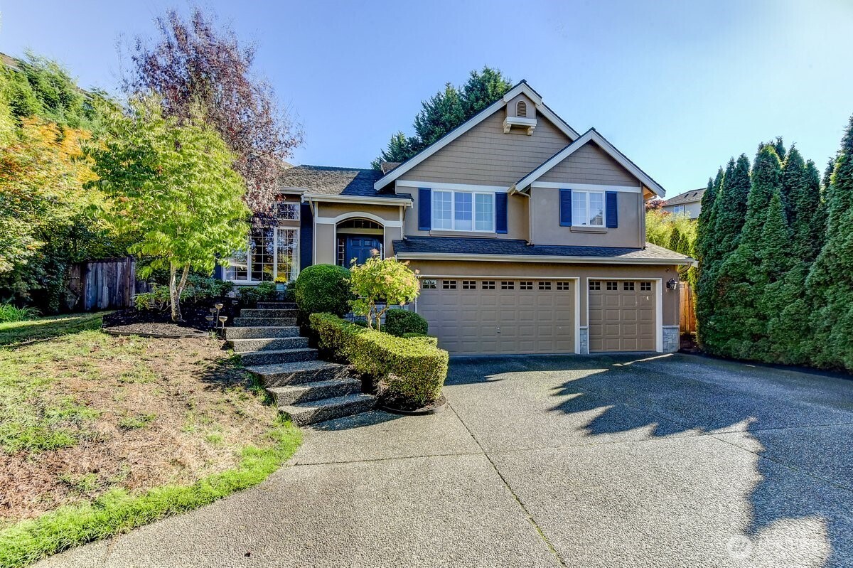 a front view of house with yard outdoor seating and barbeque oven