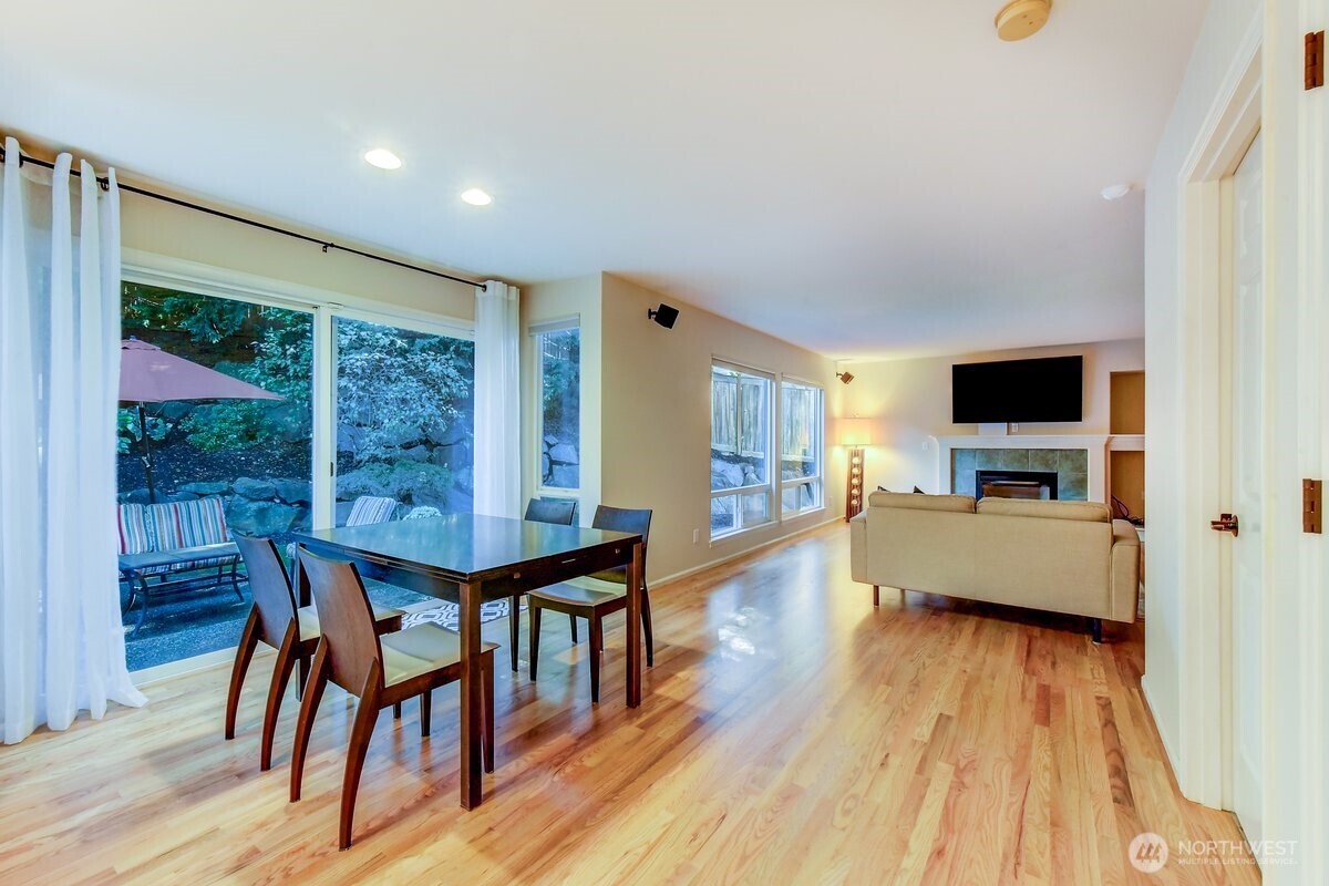 20019 27th Drive Southeast Bothell, WA 98012 - Photo 13 of 36 a dining room with furniture window and wooden floor