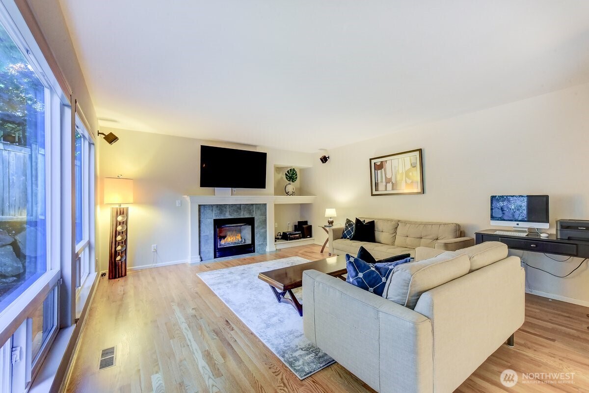 20019 27th Drive Southeast Bothell, WA 98012 - Photo 14 of 36 a living room with furniture and a fireplace