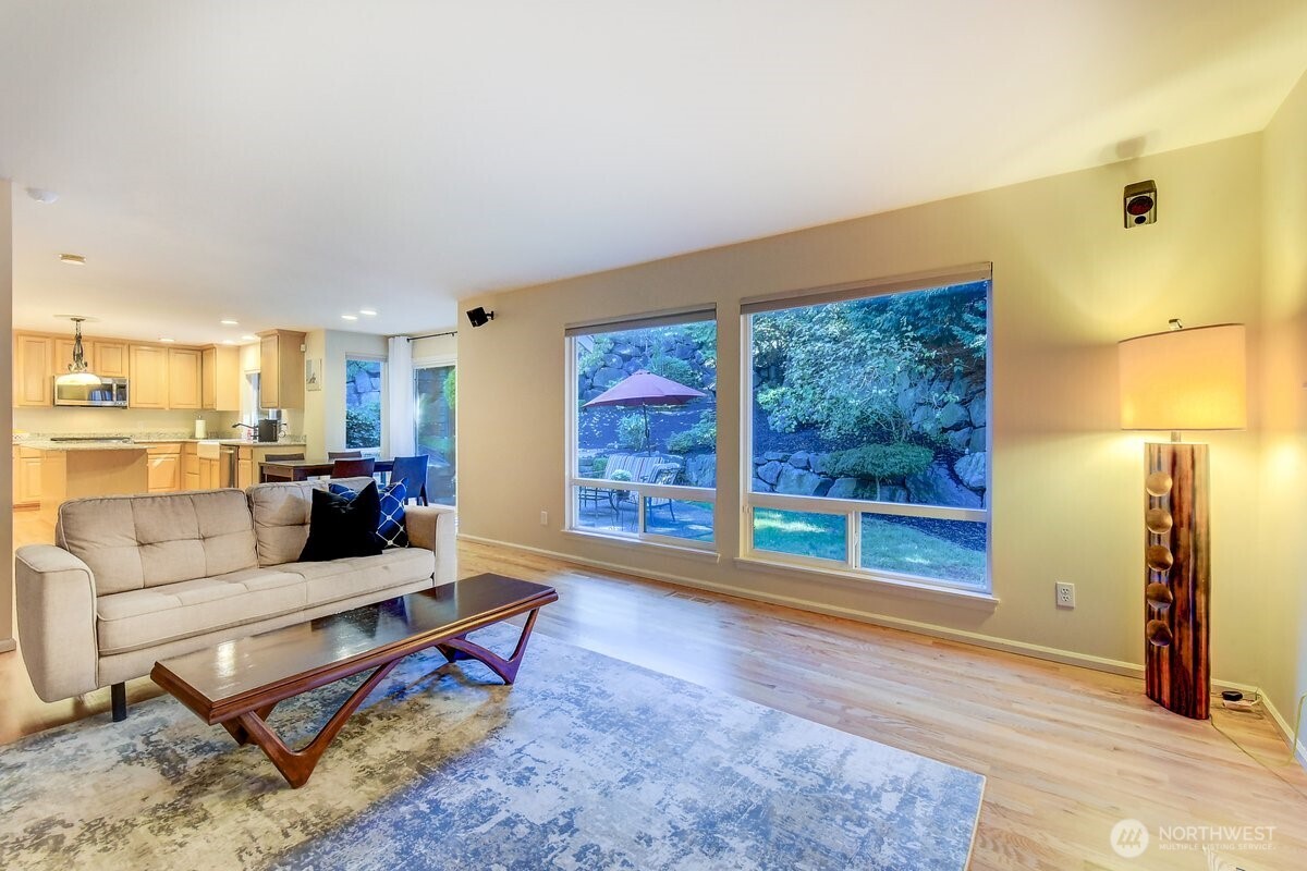 20019 27th Drive Southeast Bothell, WA 98012 - Photo 15 of 36 a living room with furniture fireplace and a large window