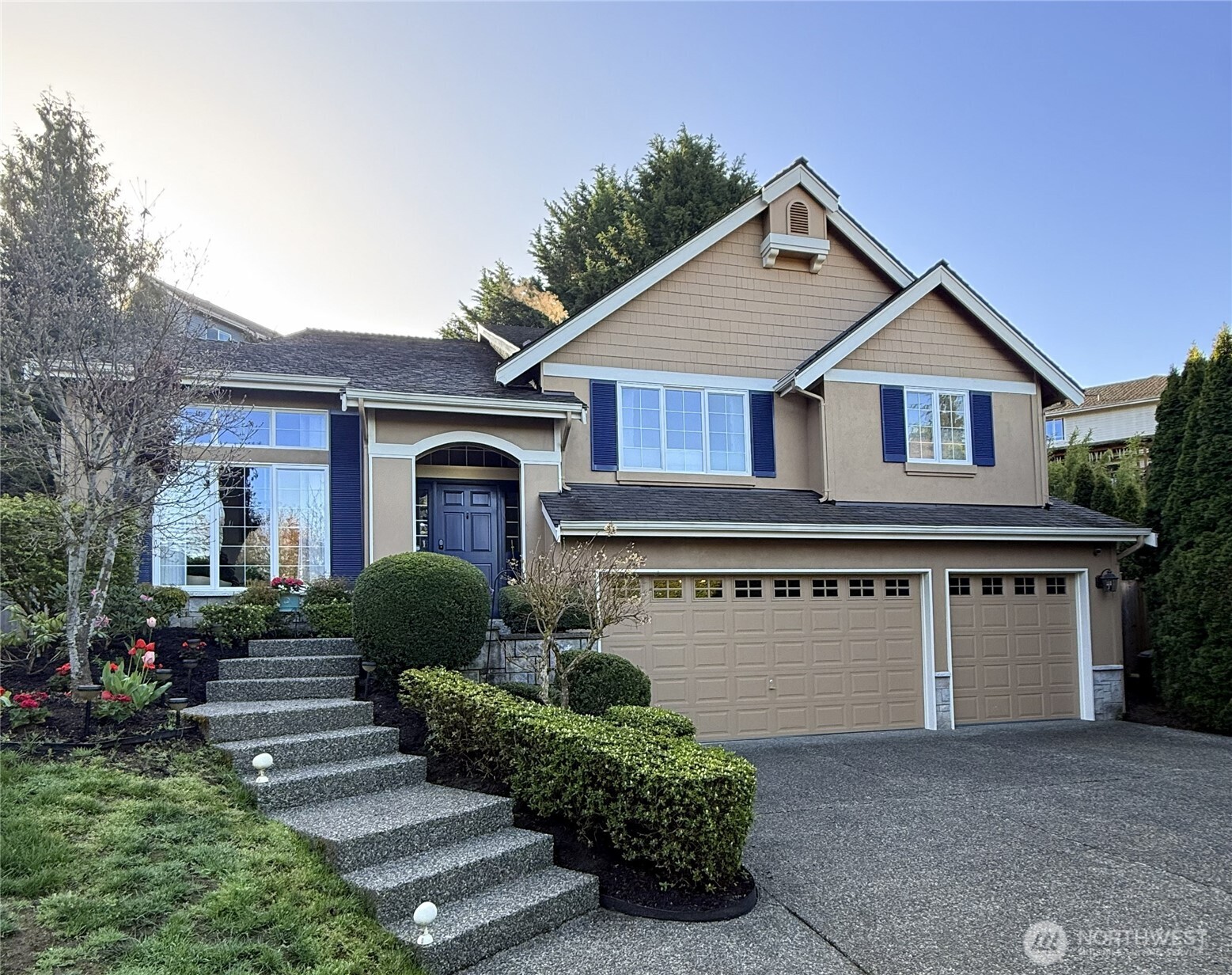 20019 27th Drive Southeast Bothell, WA 98012 - Photo 2 of 36 a front view of a house with a yard and garage