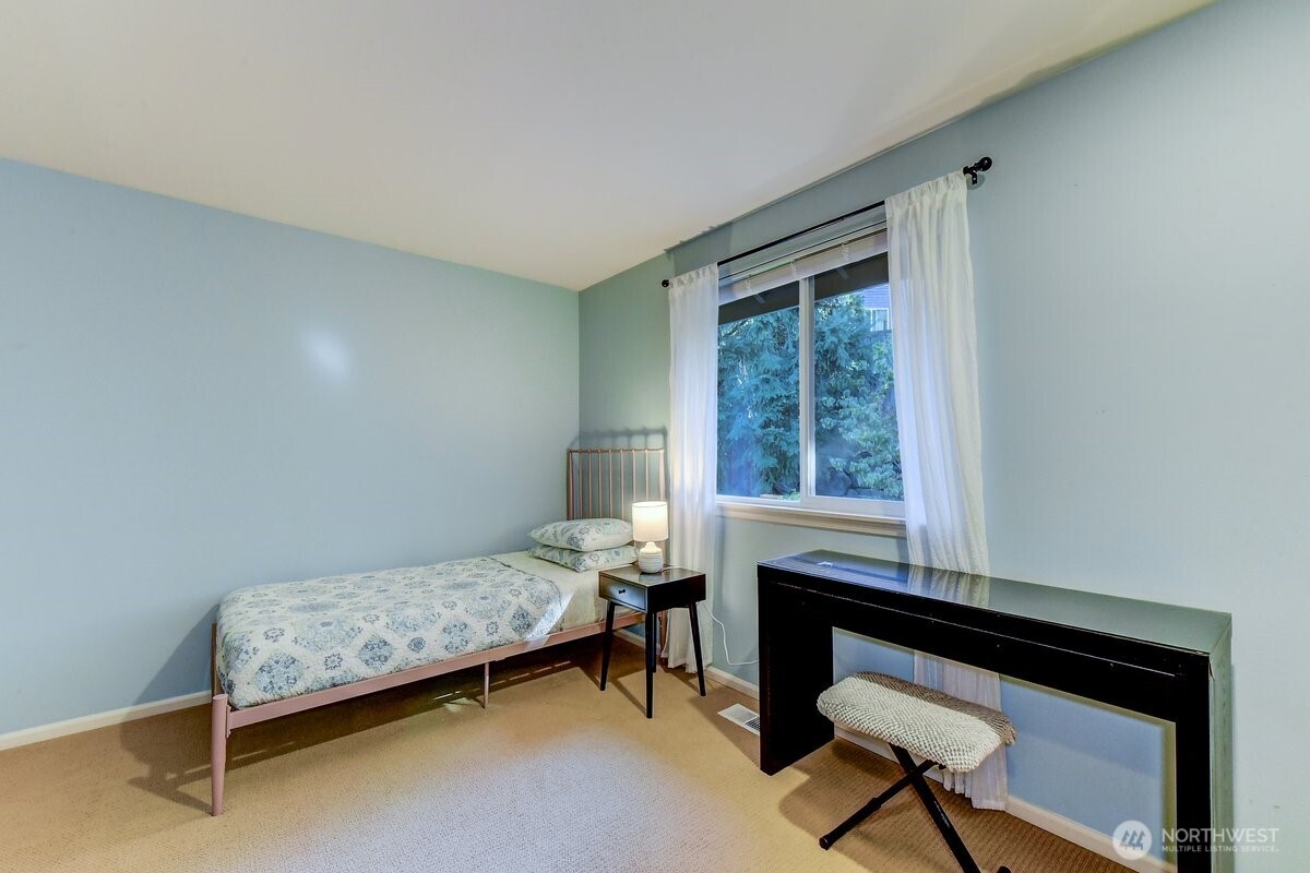 20019 27th Drive Southeast Bothell, WA 98012 - Photo 21 of 36 a bedroom with a bed and a window