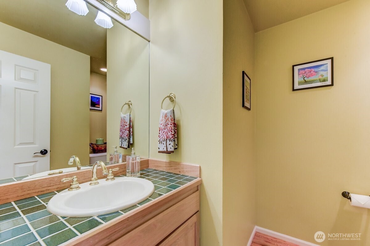 20019 27th Drive Southeast Bothell, WA 98012 - Photo 31 of 36 a bathroom with a sink mirror and a shower
