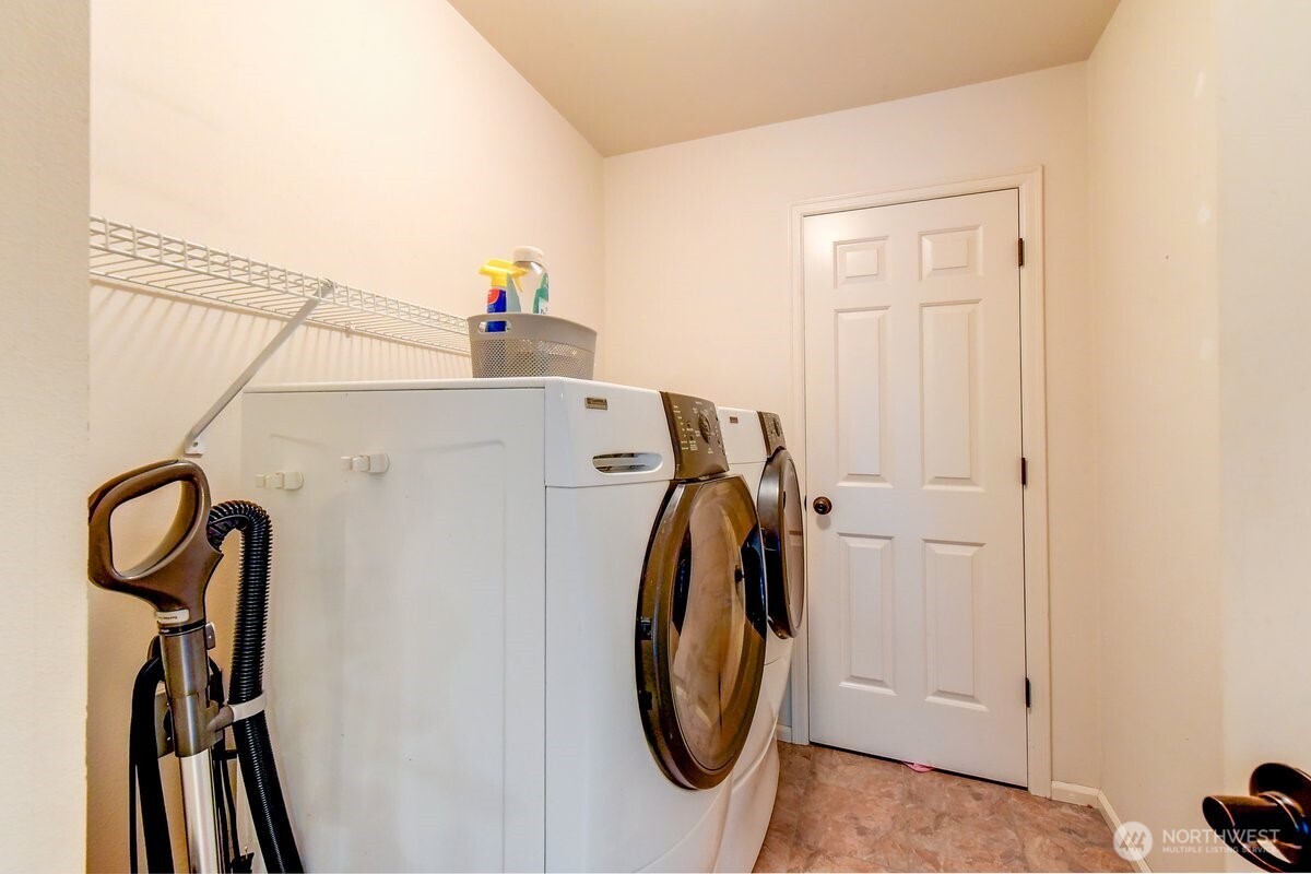 20019 27th Drive Southeast Bothell, WA 98012 - Photo 32 of 36 a view of a storage & utility room with dryer and washer