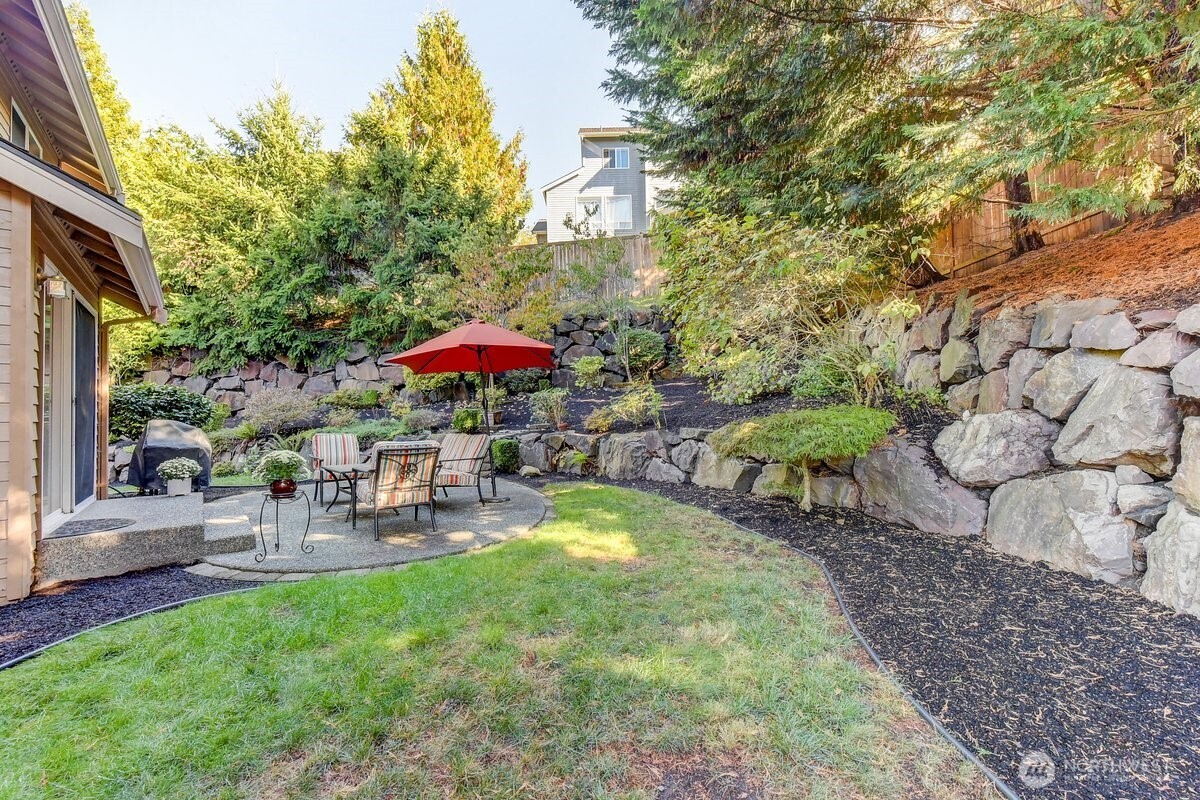 20019 27th Drive Southeast Bothell, WA 98012 - Photo 34 of 36 a view of a table and chairs under an umbrella