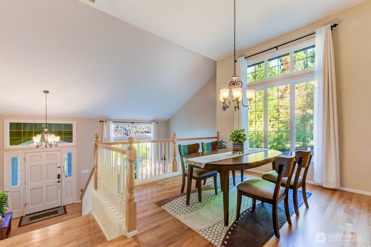 20019 27th Drive Southeast Bothell, WA 98012 - Photo 8 of 36 a view of a dining room with furniture window and wooden floor