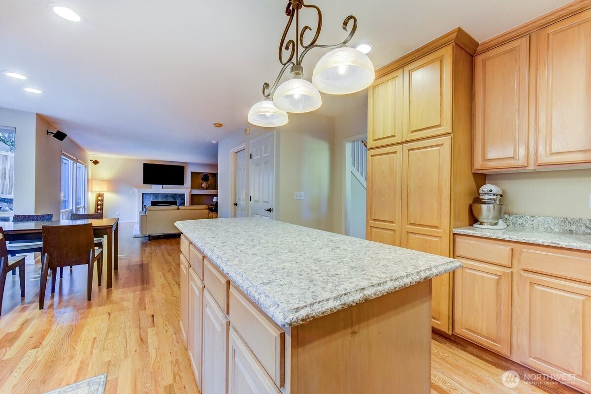 20019 27th Drive Southeast Bothell, WA 98012 - Photo 10 of 36 a kitchen with cabinets and wooden floor