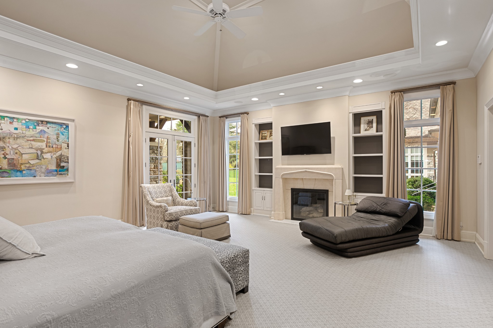 4816 Post Road Nashville, TN 37205 - Photo 16 of 54 a spacious bedroom with a large bed and a fireplace