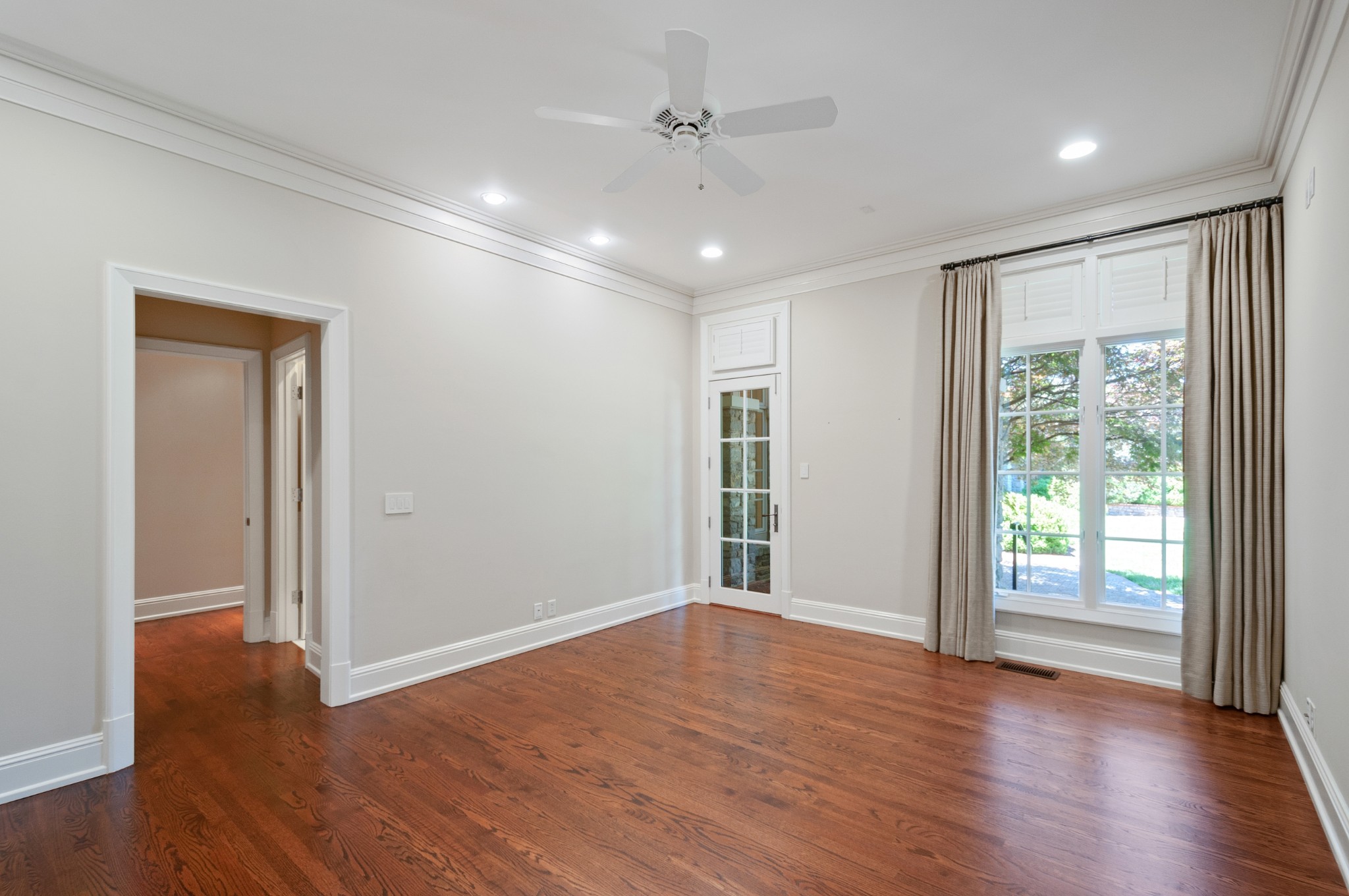 4816 Post Road Nashville, TN 37205 - Photo 19 of 54 a view of an empty room with wooden floor and a window