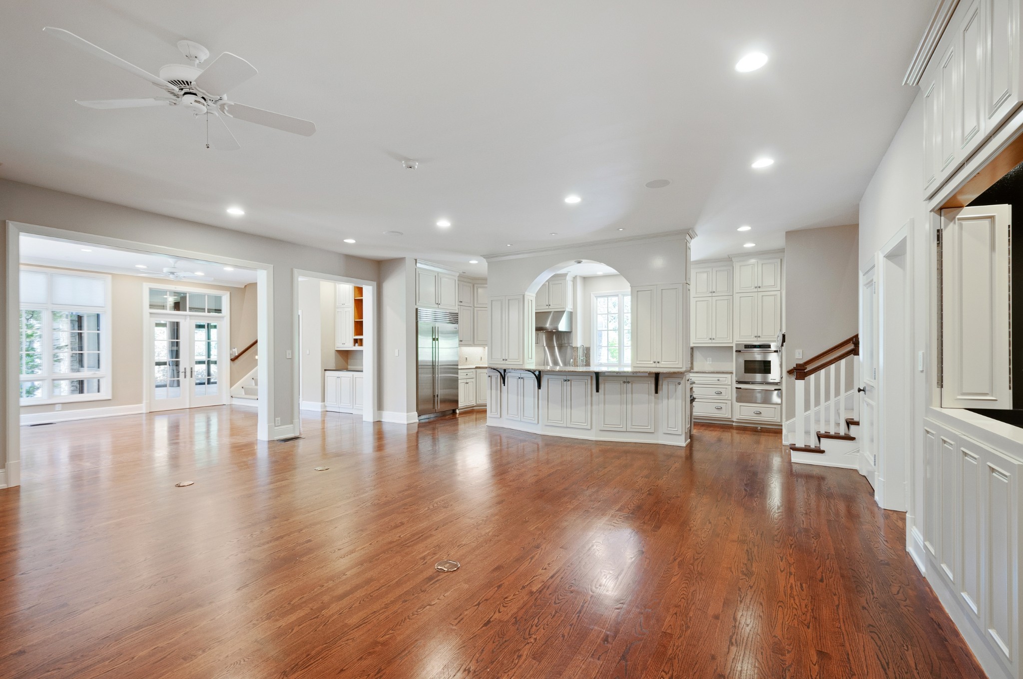 4816 Post Road Nashville, TN 37205 - Photo 22 of 54 a view of an empty room and kitchen with wooden floor