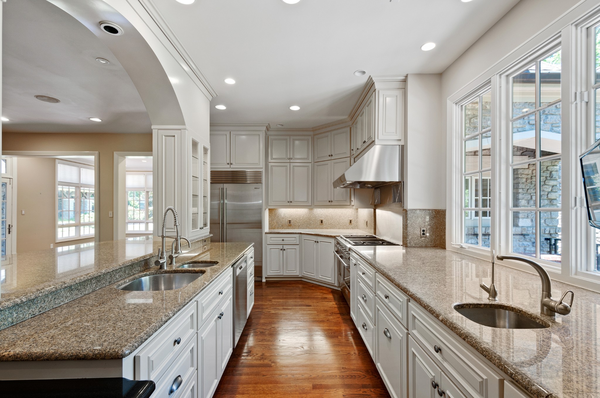 4816 Post Road Nashville, TN 37205 - Photo 24 of 54 a large kitchen with stainless steel appliances granite countertop a sink stove and refrigerator
