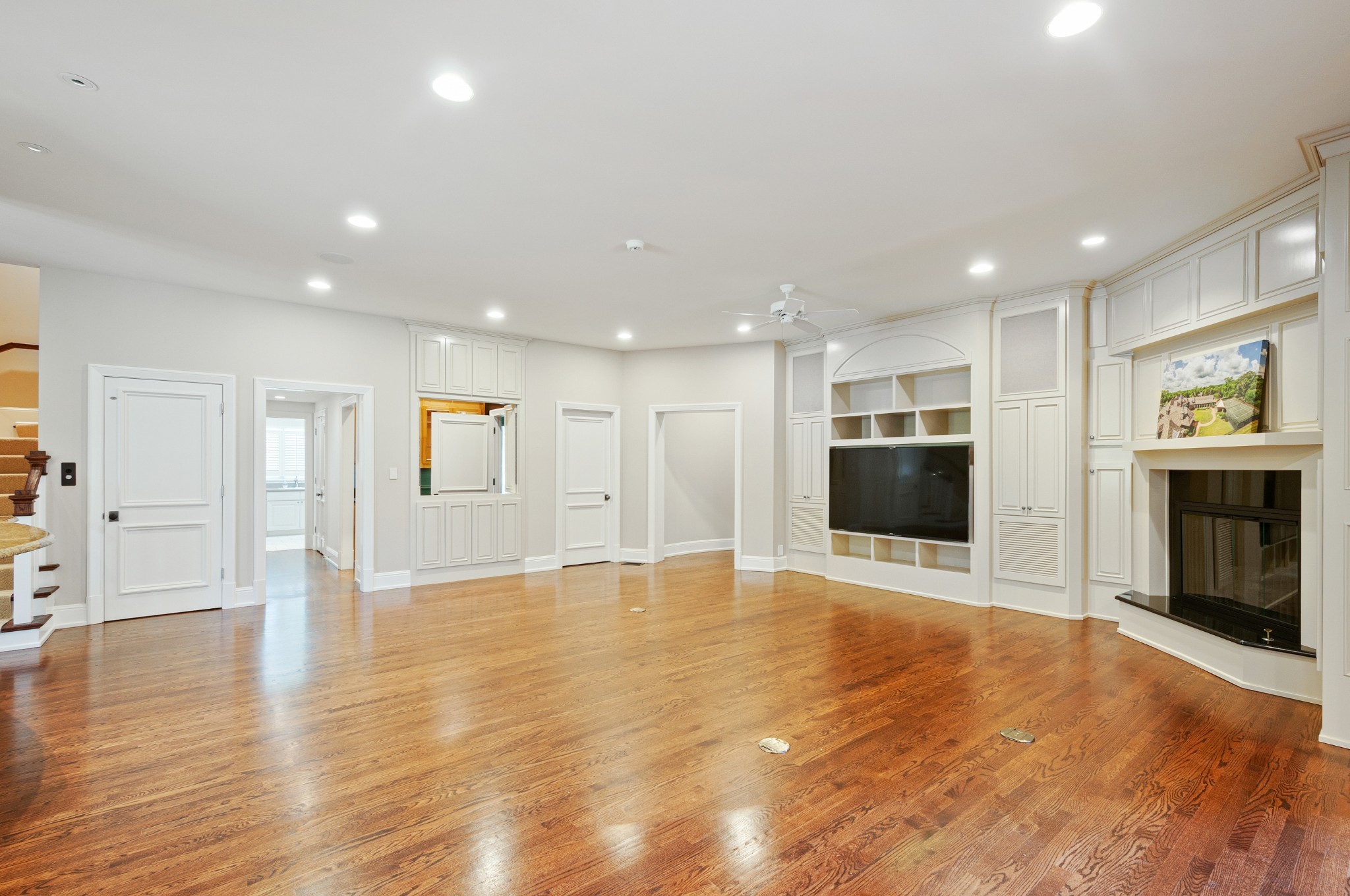 4816 Post Road Nashville, TN 37205 - Photo 26 of 54 a view of an empty room with wooden floor and a kitchen