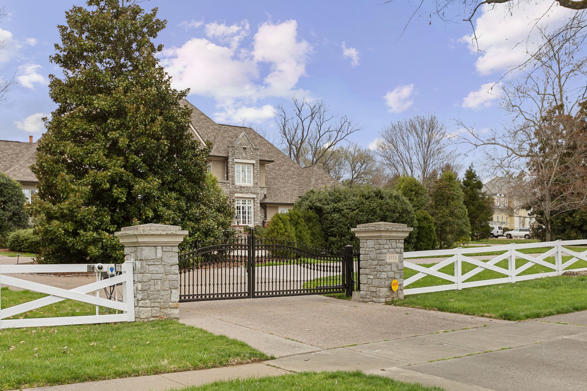 4816 Post Road Nashville, TN 37205 - Photo 3 of 54 a street sign on the side of the house