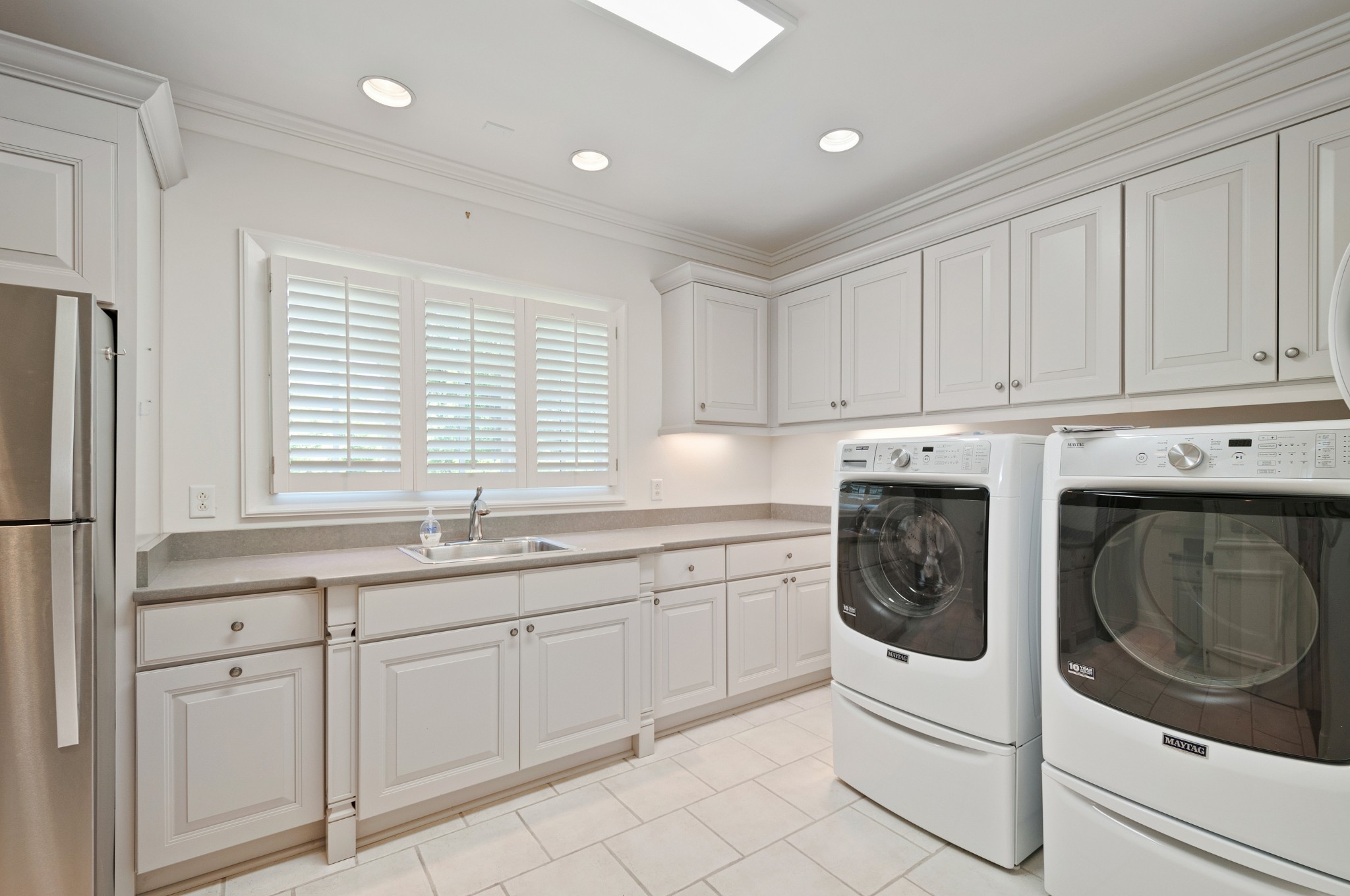 4816 Post Road Nashville, TN 37205 - Photo 31 of 54 a kitchen with white cabinets and white appliances