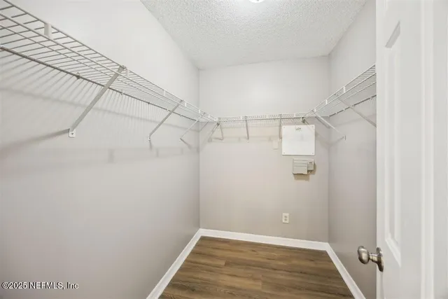 a view of a room with racks on the wall