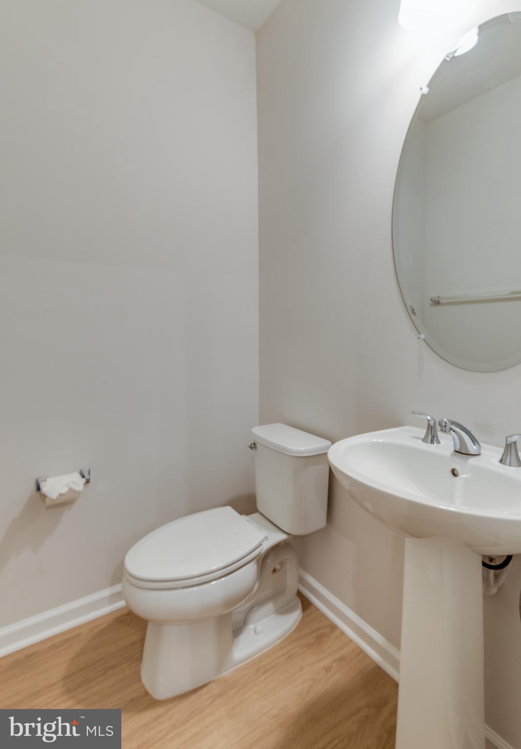 44596 Nolani Way California, MD 20619 - Photo 17 of 31 a white toilet sitting next to a bathroom sink