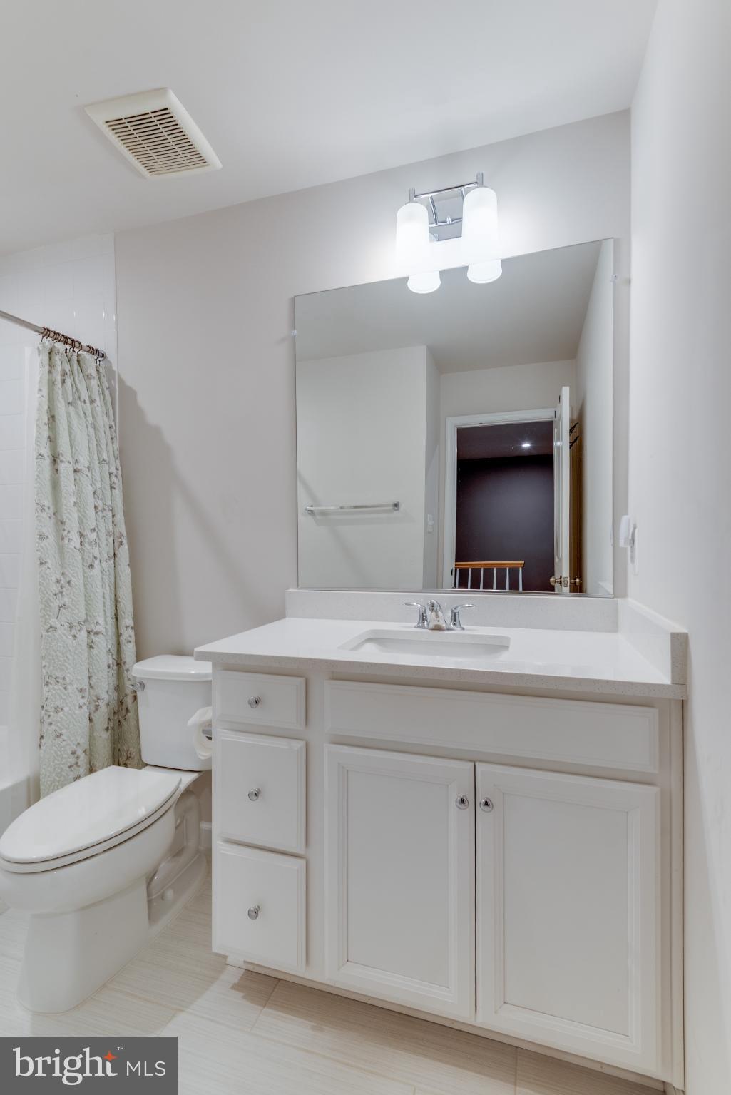 44596 Nolani Way California, MD 20619 - Photo 22 of 31 a bathroom with a sink a toilet and a mirror
