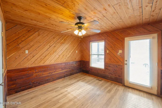 a view of a hall with wooden floor
