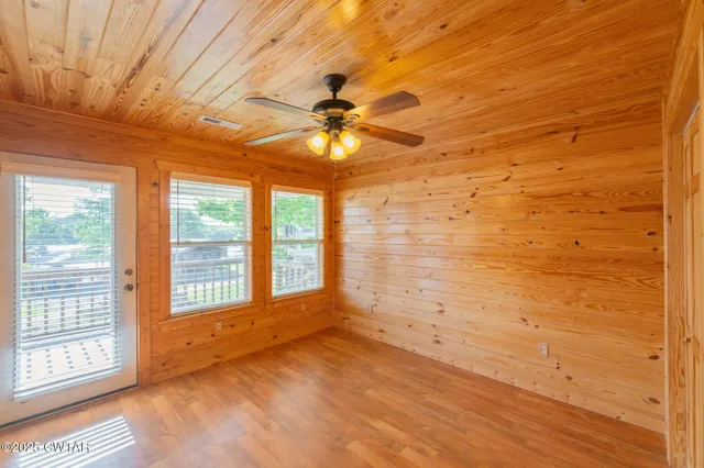 a view of hallway with wooden floor