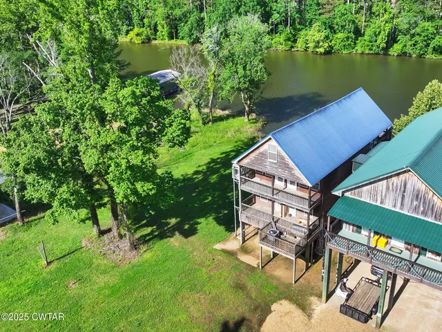 a small pool with couple of water fountain in the back yard