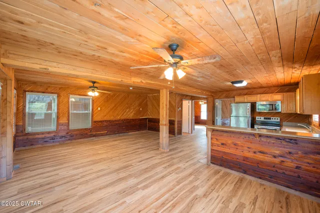a view of a living room and kitchen