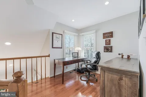 a living room with furniture fireplace and a fireplace