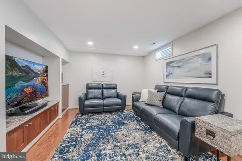 a view of a bedroom with furniture and closet