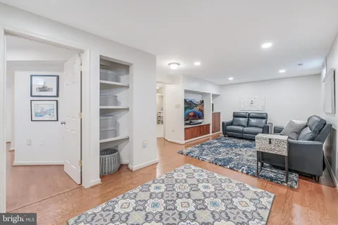 a bedroom with a large bed and a painting