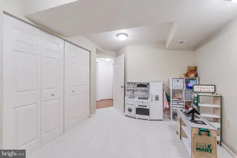 a bedroom with a bed and a lamp