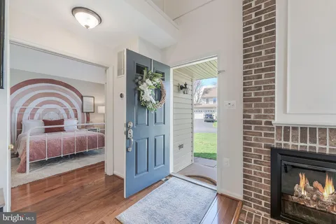 a bedroom with furniture and a fireplace