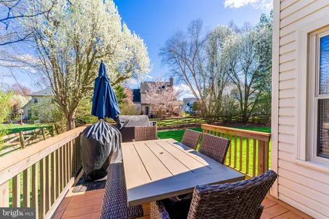 a front view of house with yard and outdoor seating