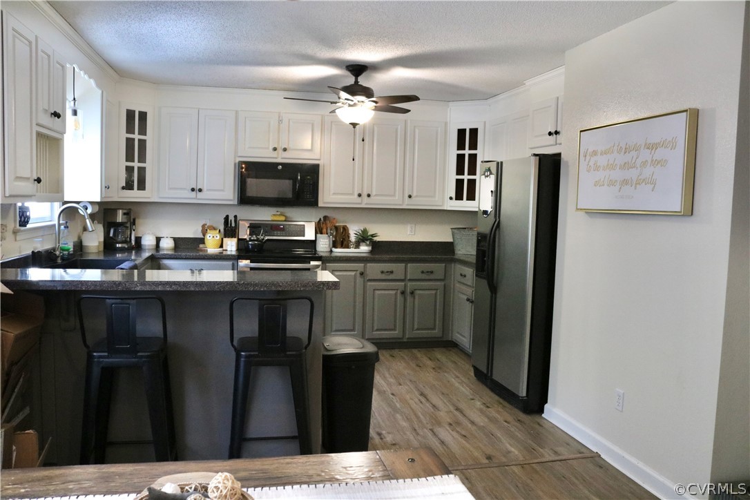 20434 Horseshoe Road Carson, VA 23830 - Photo 24 of 28 a kitchen with stainless steel appliances a sink stove and refrigerator