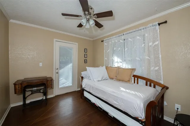 a bed room with a bed and a chair