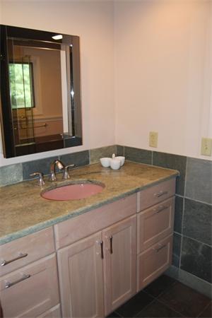 237 East Emerson Road Lexington, MA 02420 - Photo 16 of 22 a bathroom with a sink and a mirror