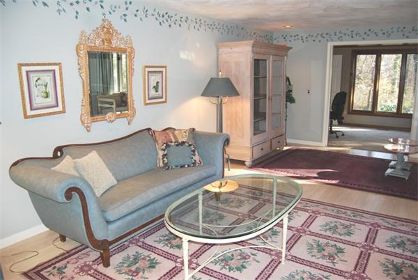 237 East Emerson Road Lexington, MA 02420 - Photo 4 of 22 a living room with furniture and a chandelier