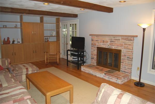 237 East Emerson Road Lexington, MA 02420 - Photo 7 of 22 a room with furniture and a fireplace
